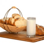 White bread and milk in glass